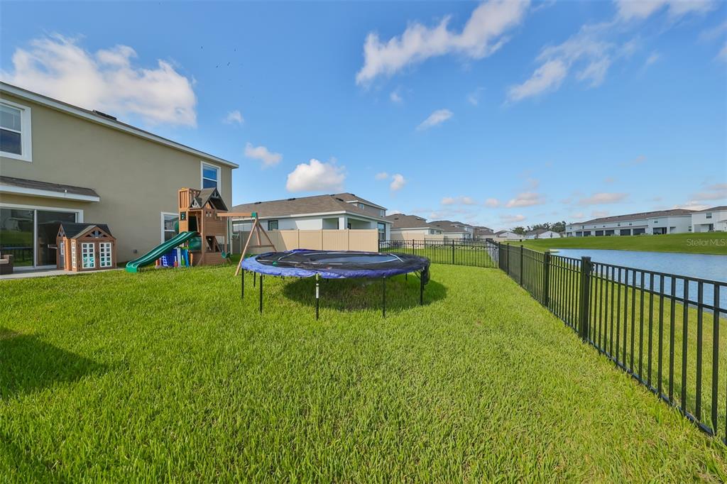 3528 Maple Grv Way Plant City, FL 33565 - Photo 44 of 51 a view of a house with a swimming pool and a yard