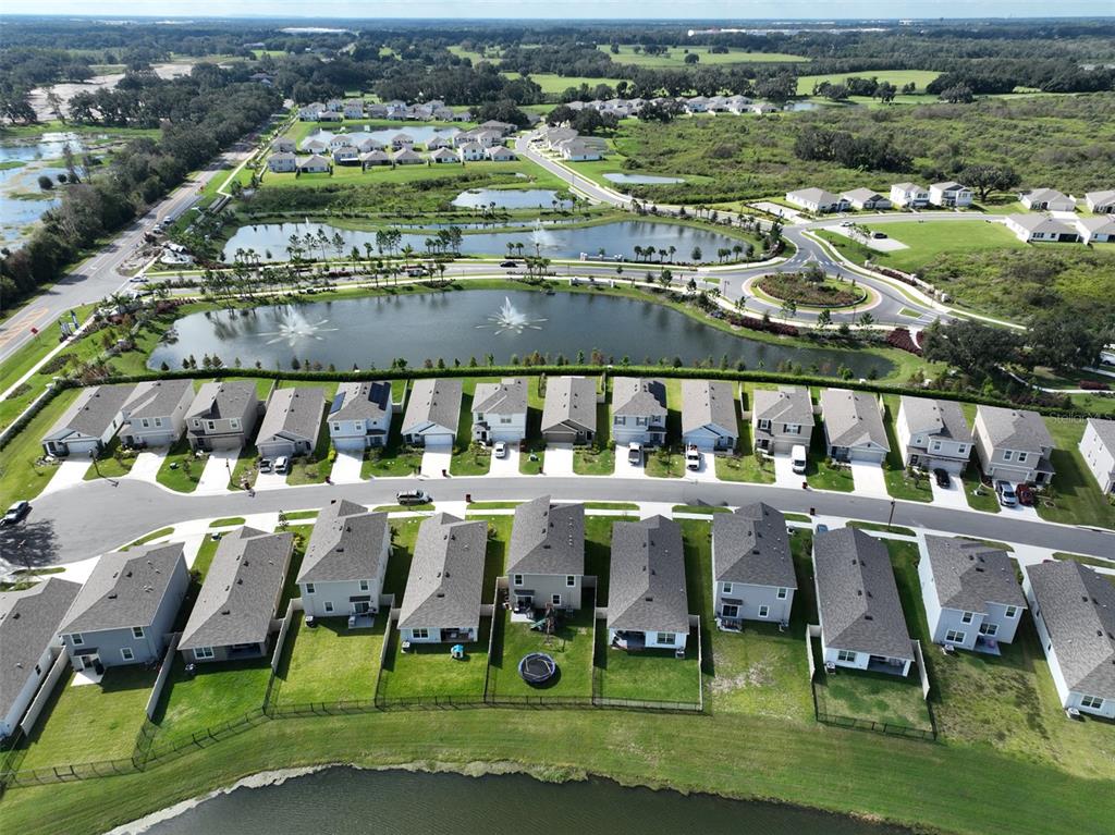 3528 Maple Grv Way Plant City, FL 33565 - Photo 47 of 51 an aerial view of residential houses with outdoor space and parking