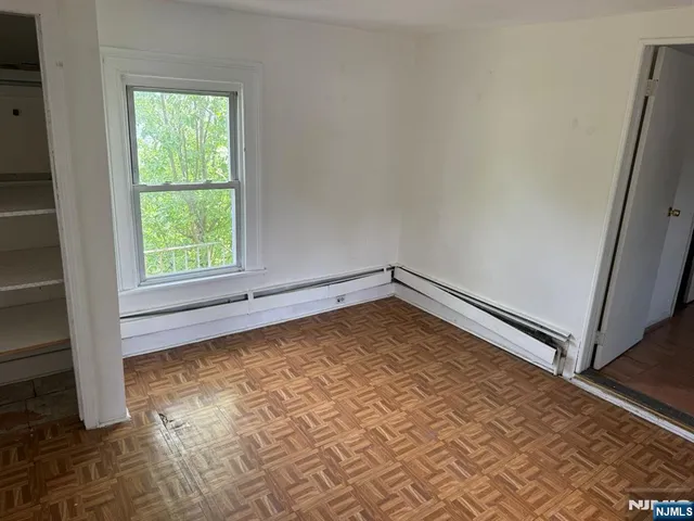 an empty room with a empty space and window