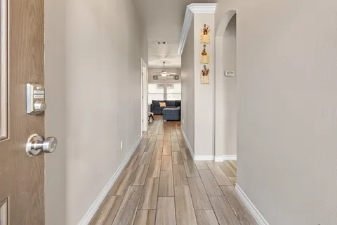 a living room with furniture and a large mirror