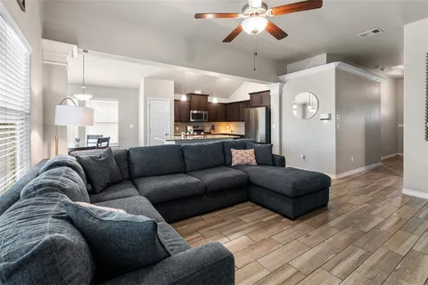 a view of a dining room with furniture and wooden floor