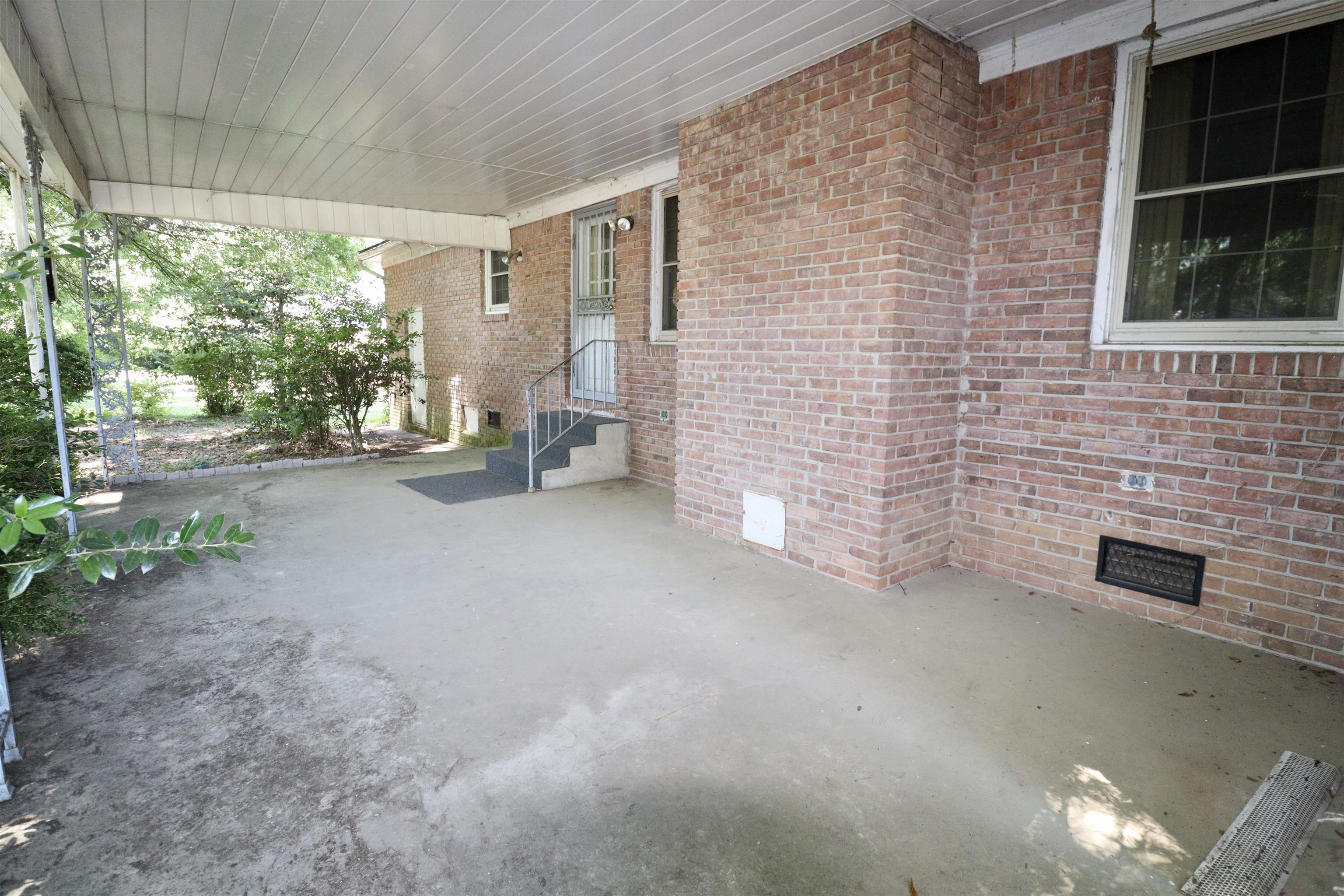 274 Church Street Ripley, TN 38063 - Photo 21 of 30 a view of a patio with table and chairs and potted plants