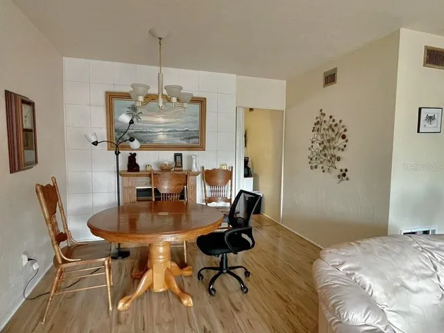 a workspace with furniture and wooden floor