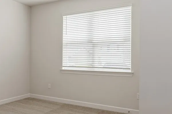 a picture of a bench in front of a window