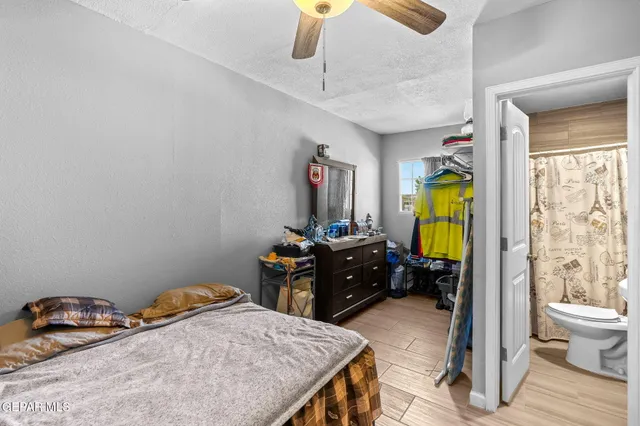 a white toilet sitting next to a bathroom sink