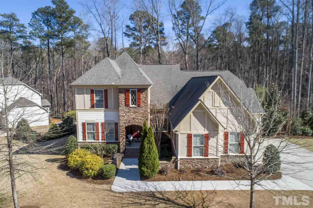 12819 Edsel Drive Raleigh, NC 27613 - Photo 1 of 30 a front view of a house with garden