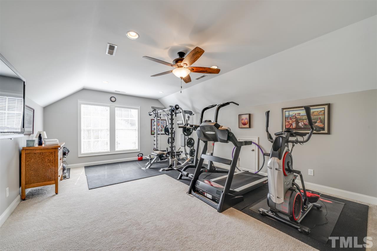 12819 Edsel Drive Raleigh, NC 27613 - Photo 18 of 30 a view of a room with gym equipment