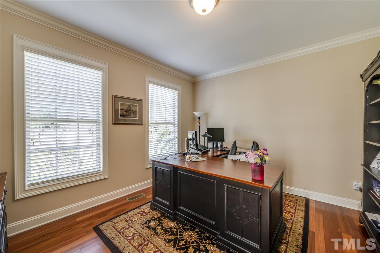 12819 Edsel Drive Raleigh, NC 27613 - Photo 3 of 30 a room with furniture wooden floor and a window