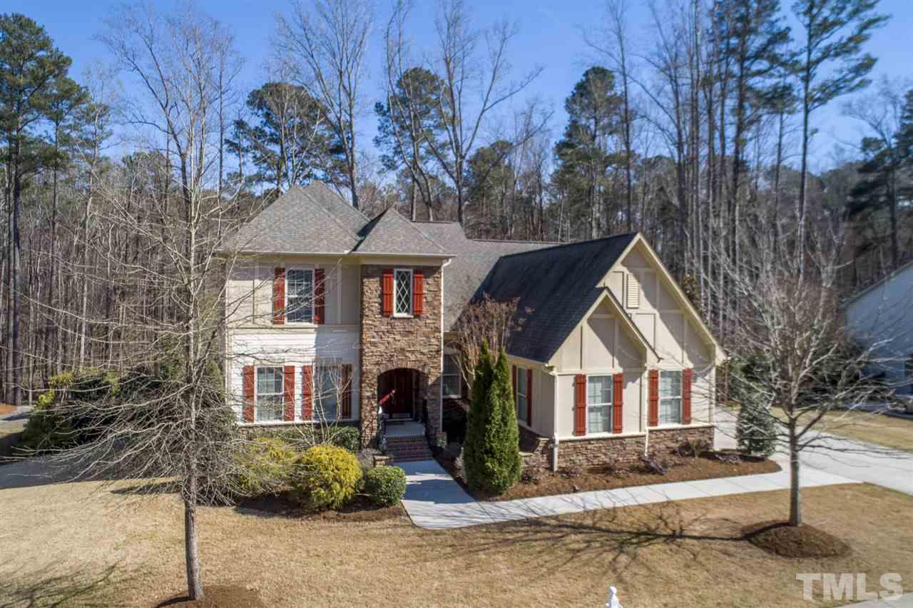 12819 Edsel Drive Raleigh, NC 27613 - Photo 25 of 30 a front view of a house with garden