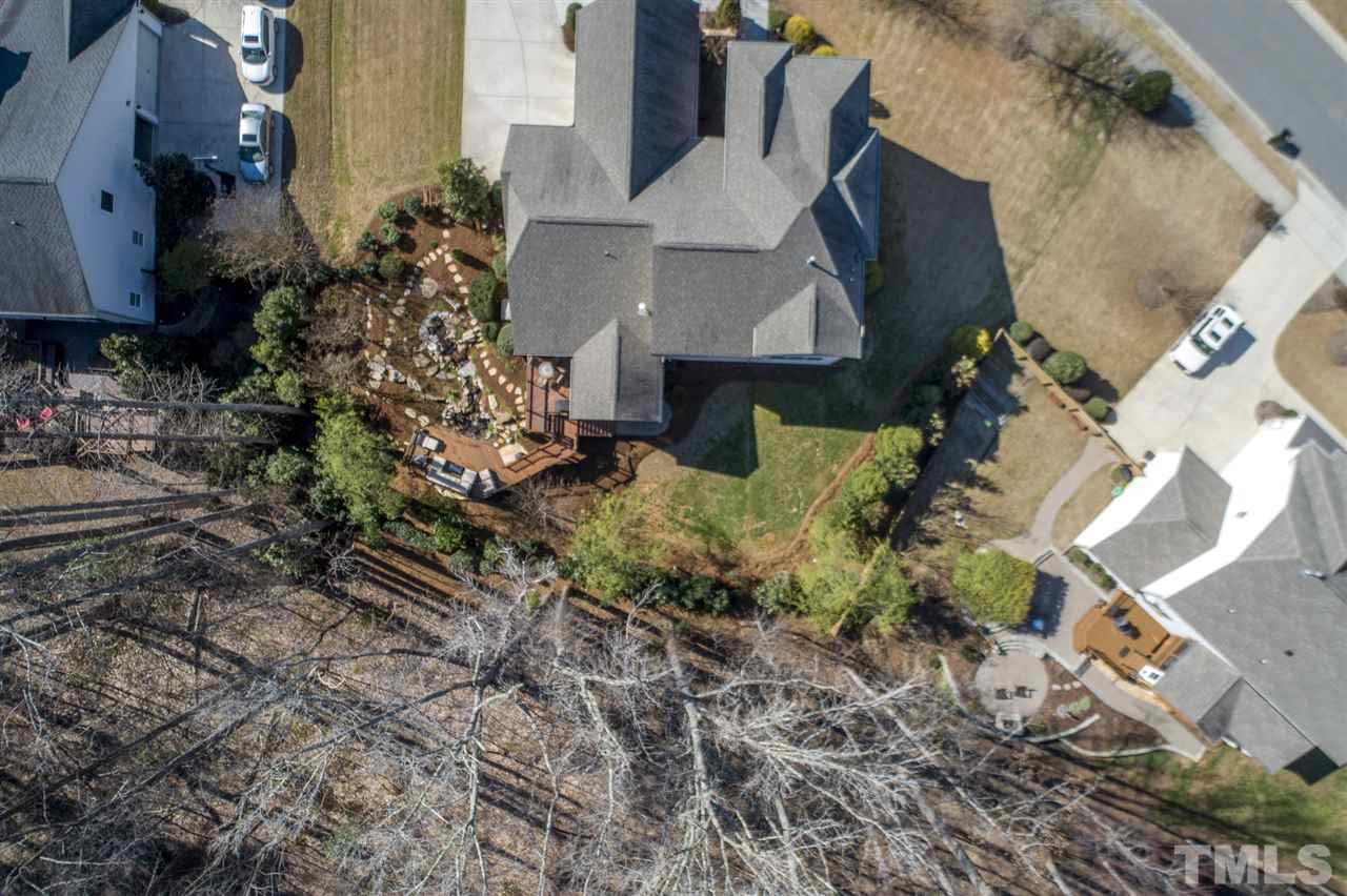 12819 Edsel Drive Raleigh, NC 27613 - Photo 27 of 30 an aerial view of a house with a yard and large trees