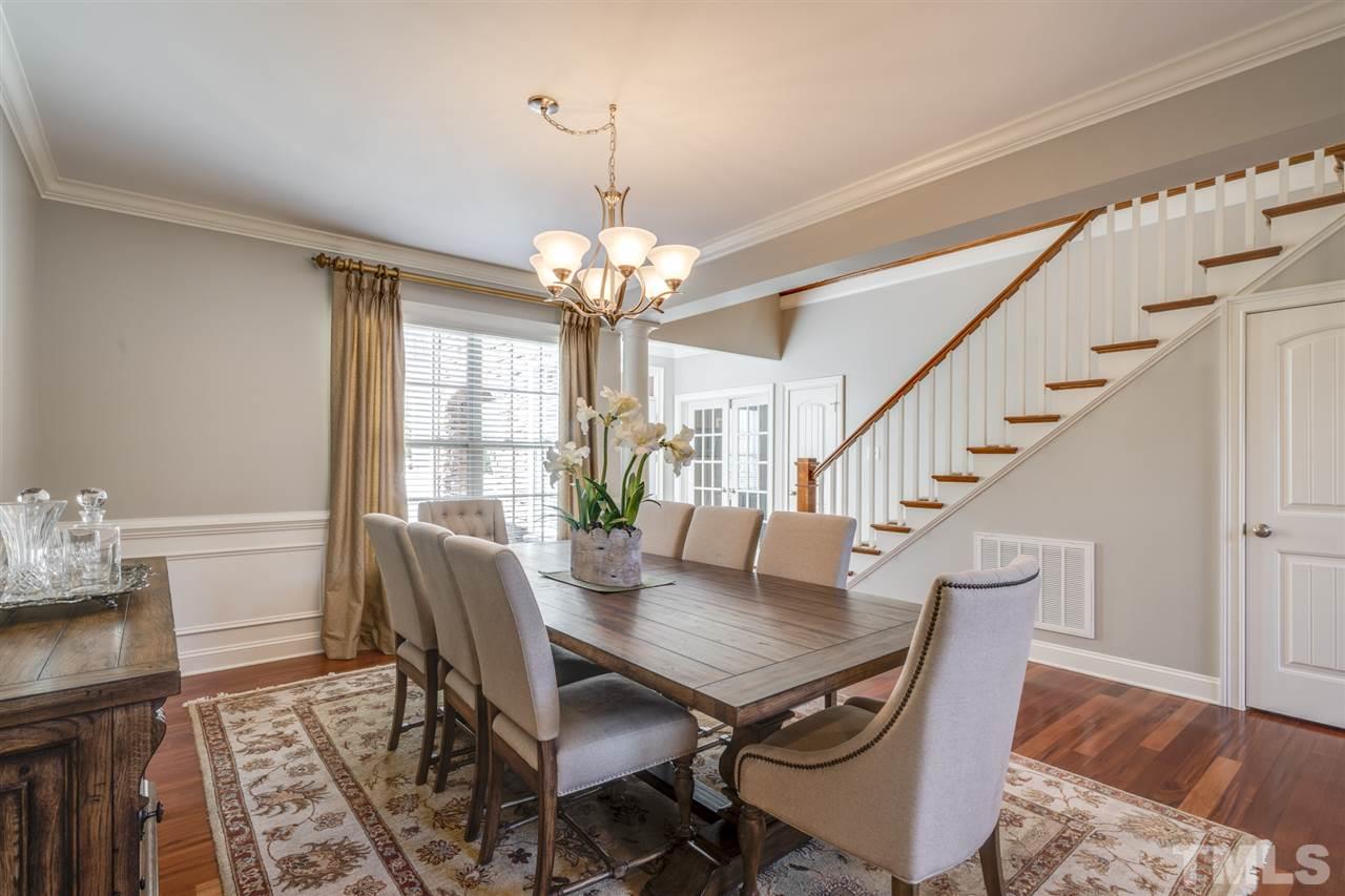 12819 Edsel Drive Raleigh, NC 27613 - Photo 5 of 30 a view of a dining room with furniture wooden floor and chandelier