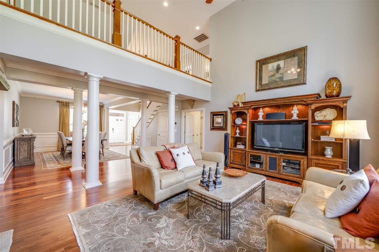 12819 Edsel Drive Raleigh, NC 27613 - Photo 6 of 30 a living room with furniture and a flat screen tv