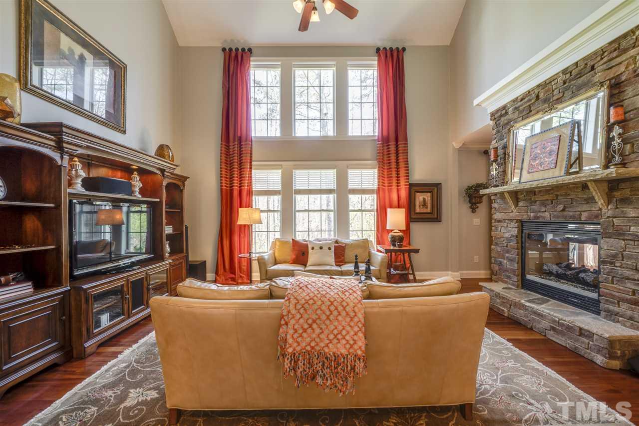 12819 Edsel Drive Raleigh, NC 27613 - Photo 8 of 30 a living room with fireplace furniture and a window