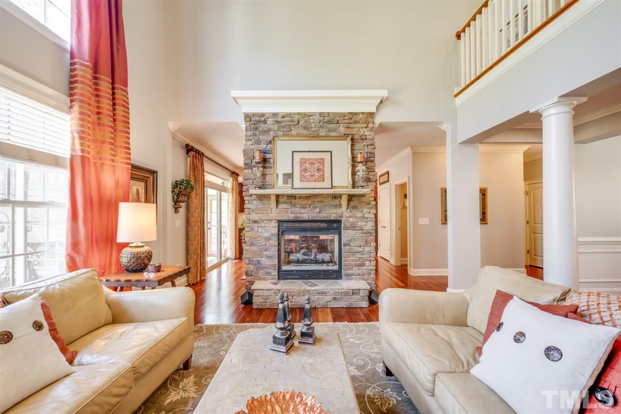 12819 Edsel Drive Raleigh, NC 27613 - Photo 9 of 30 a living room with furniture and a fireplace
