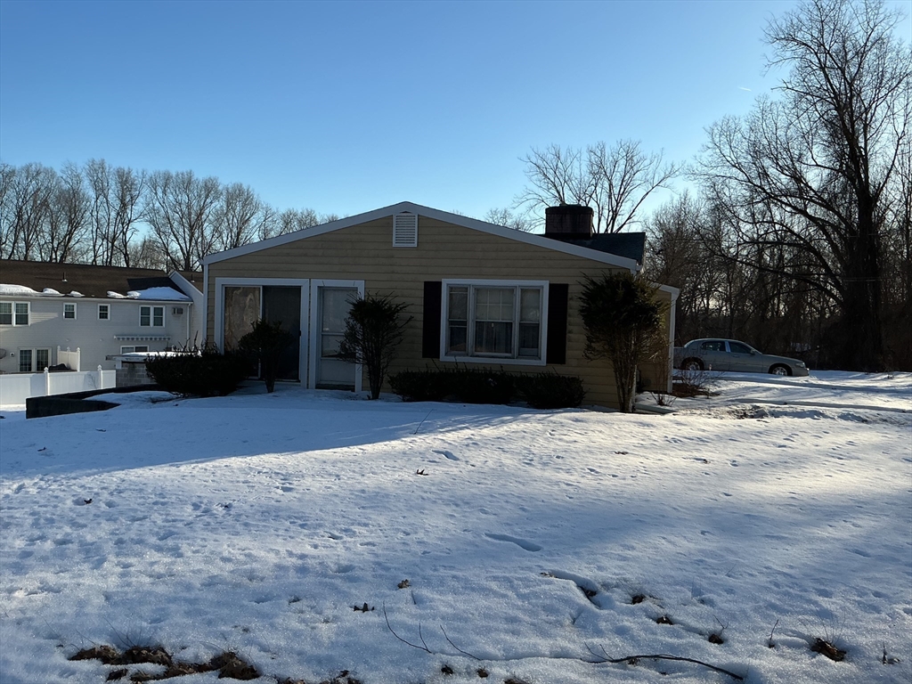 251 Fuller Road Chicopee, MA 01020 - Photo 1 of 19 a front view of a house with a yard