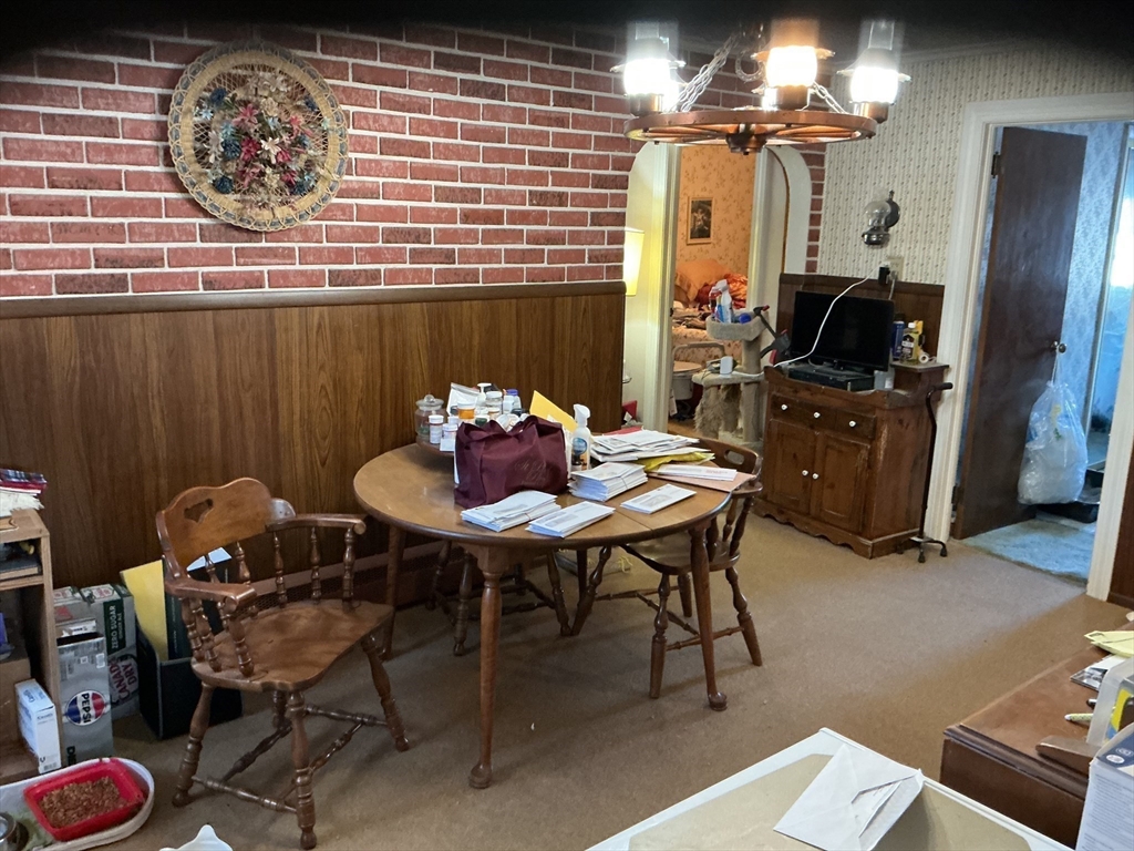 251 Fuller Road Chicopee, MA 01020 - Photo 5 of 19 a dining room with furniture and a chandelier