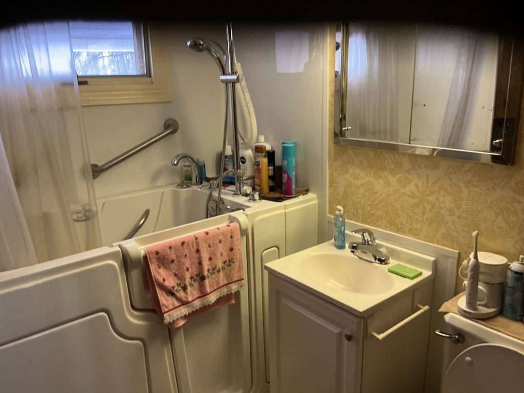 251 Fuller Road Chicopee, MA 01020 - Photo 6 of 19 a bathroom with a sink and a mirror