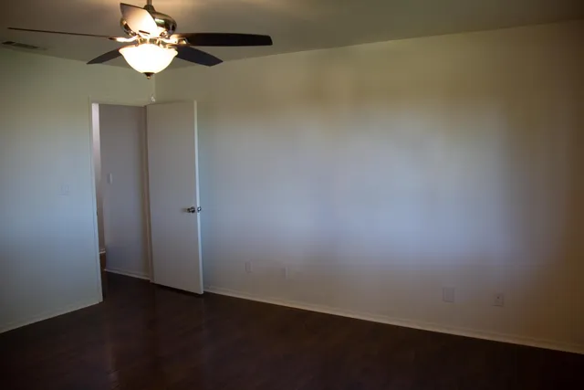 a view of a chandelier fan and closet in a room