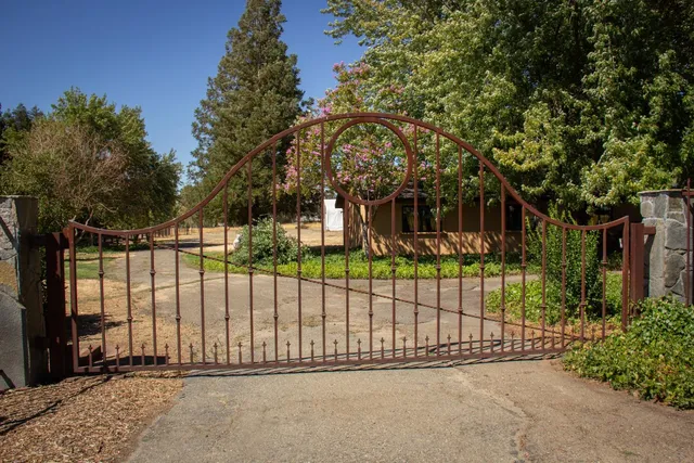 a view of a gate with a street view