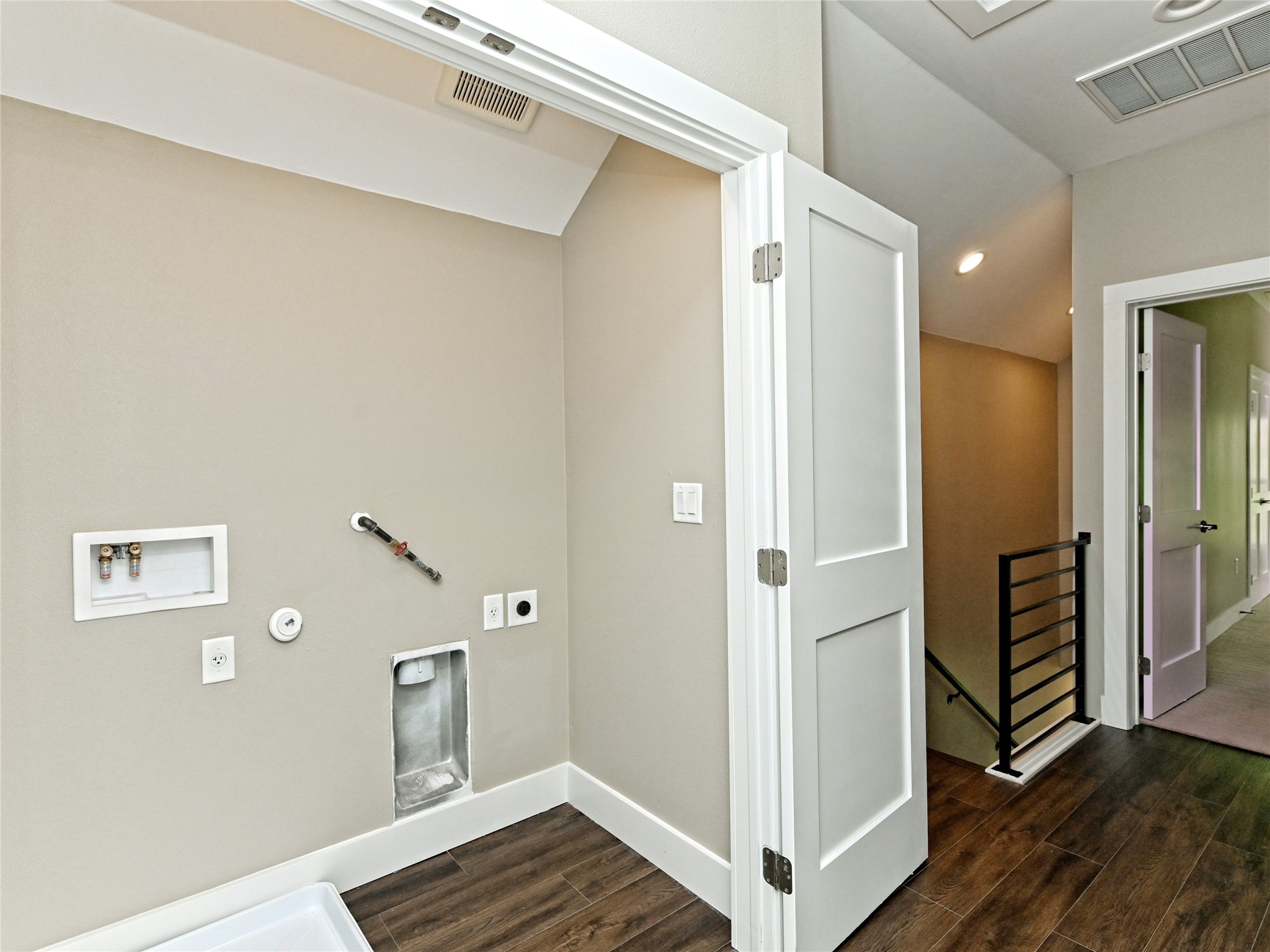1202 Cometa Street, Unit B Austin, TX 78721 - Photo 12 of 25 a view of a hallway with wooden floor and entryway