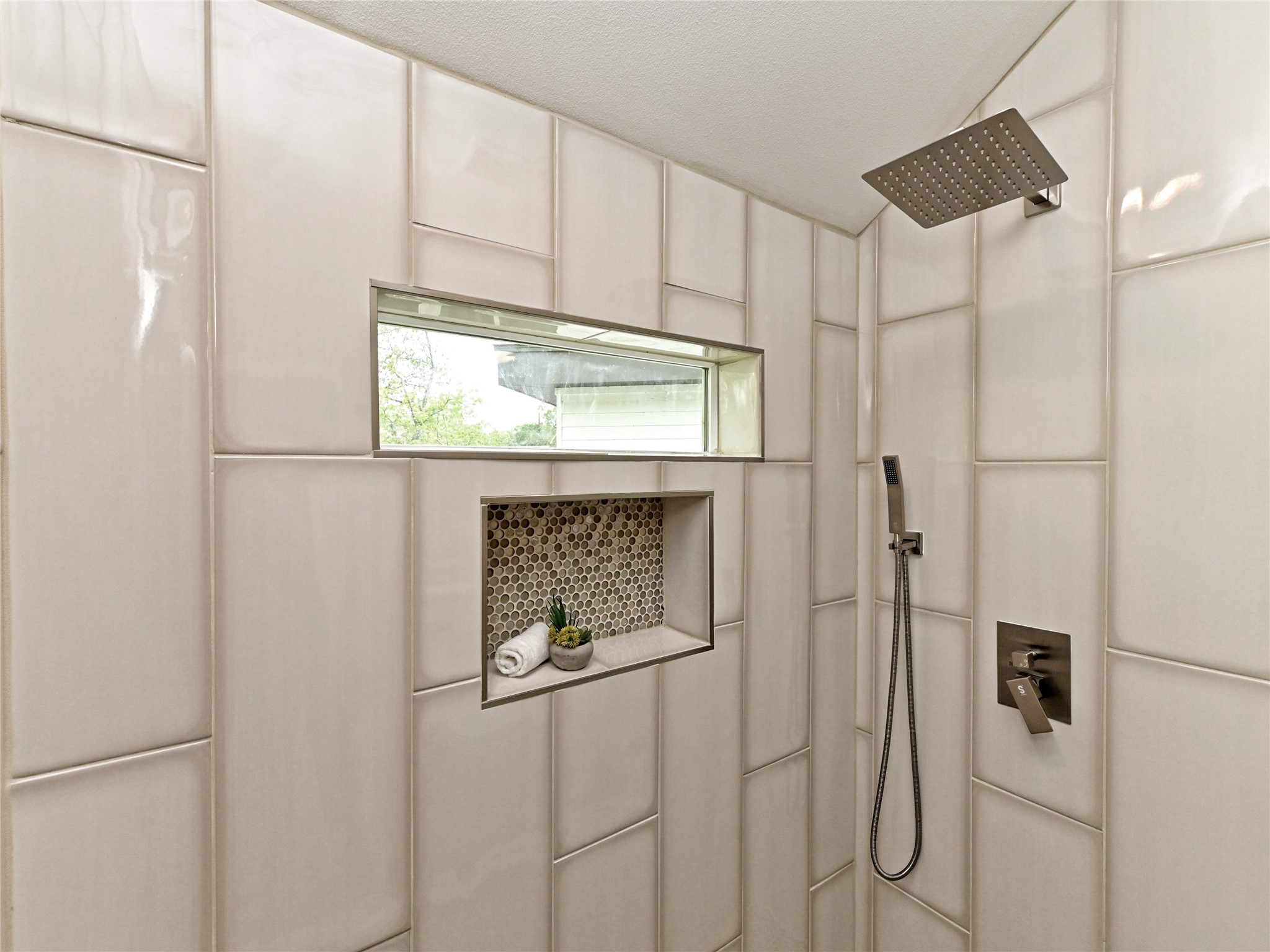 1202 Cometa Street, Unit B Austin, TX 78721 - Photo 16 of 25 a bathroom with a shower and a window