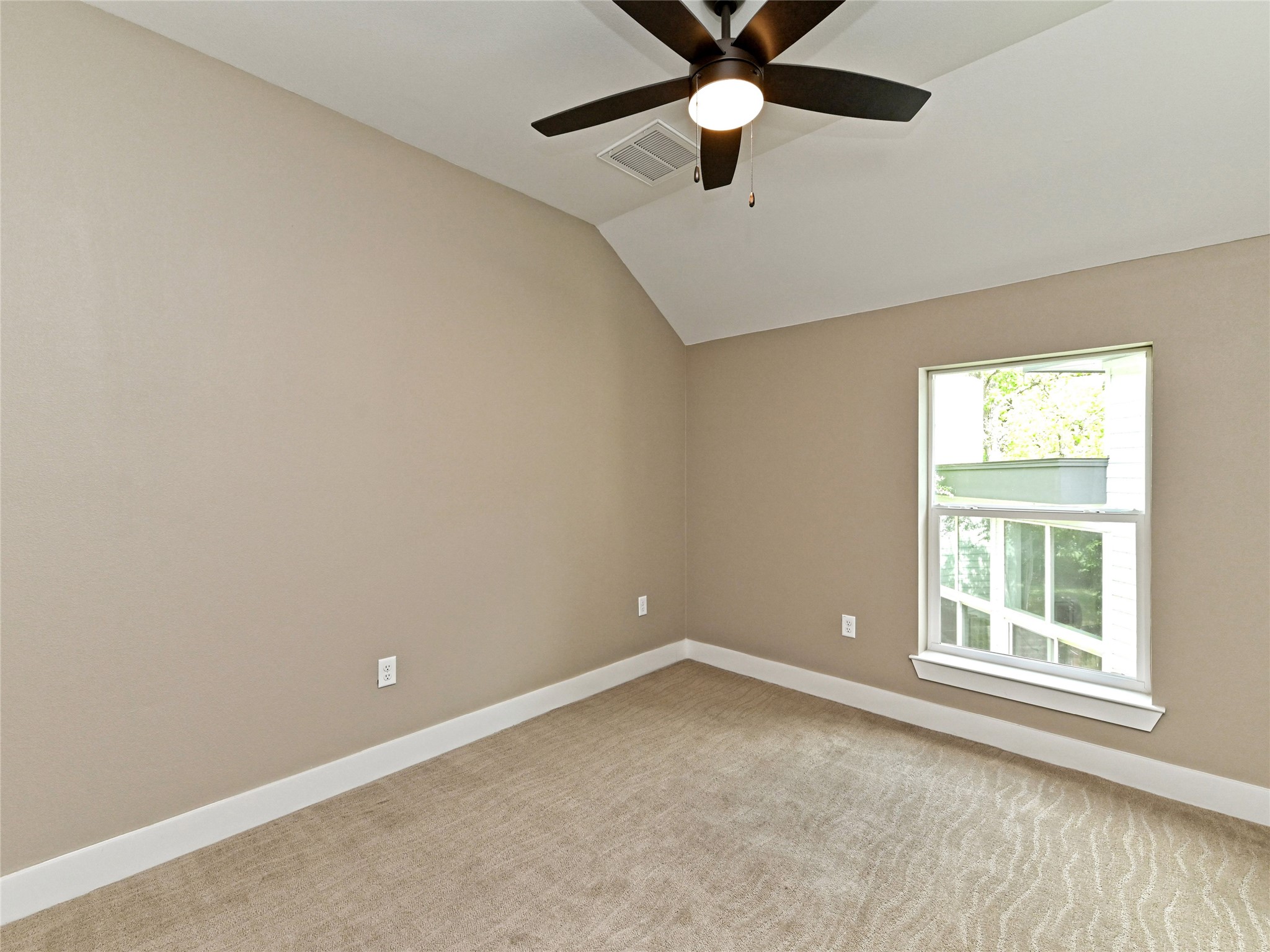 1202 Cometa Street, Unit B Austin, TX 78721 - Photo 20 of 25 an empty room with a window and a fan