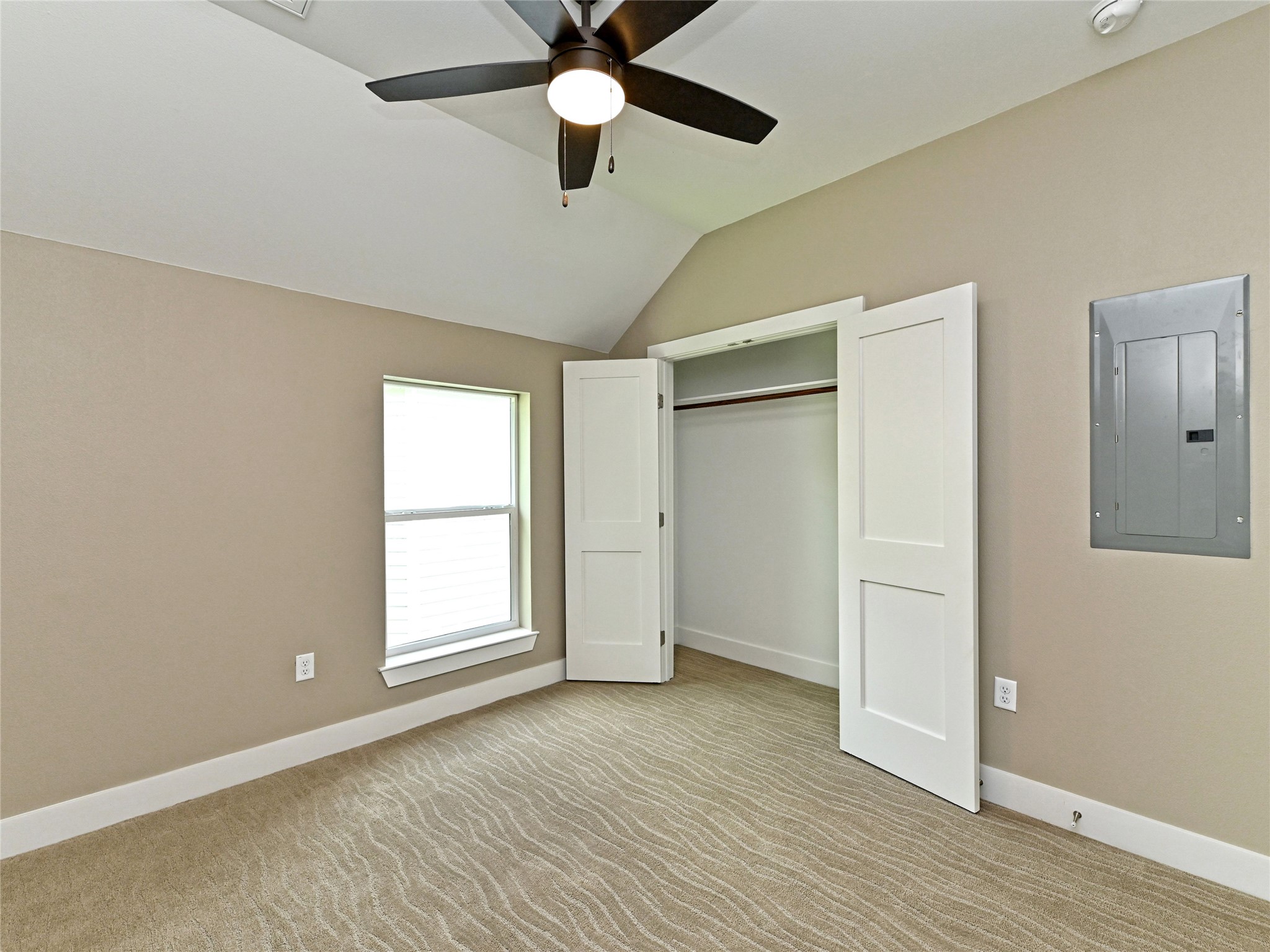 1202 Cometa Street, Unit B Austin, TX 78721 - Photo 21 of 25 a view of an empty room with wooden floor and a window