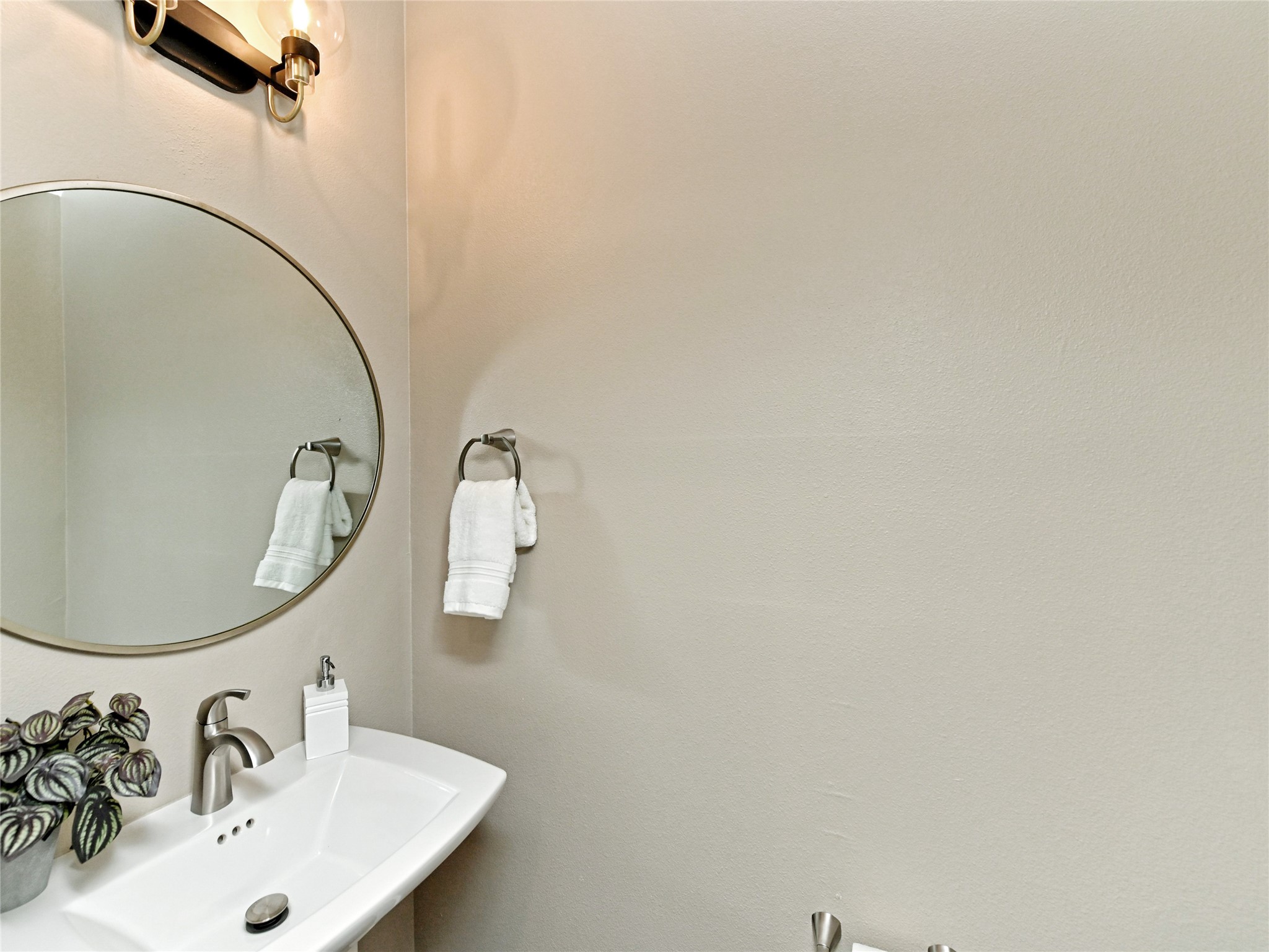 1202 Cometa Street, Unit B Austin, TX 78721 - Photo 22 of 25 a bathroom with a sink and a mirror