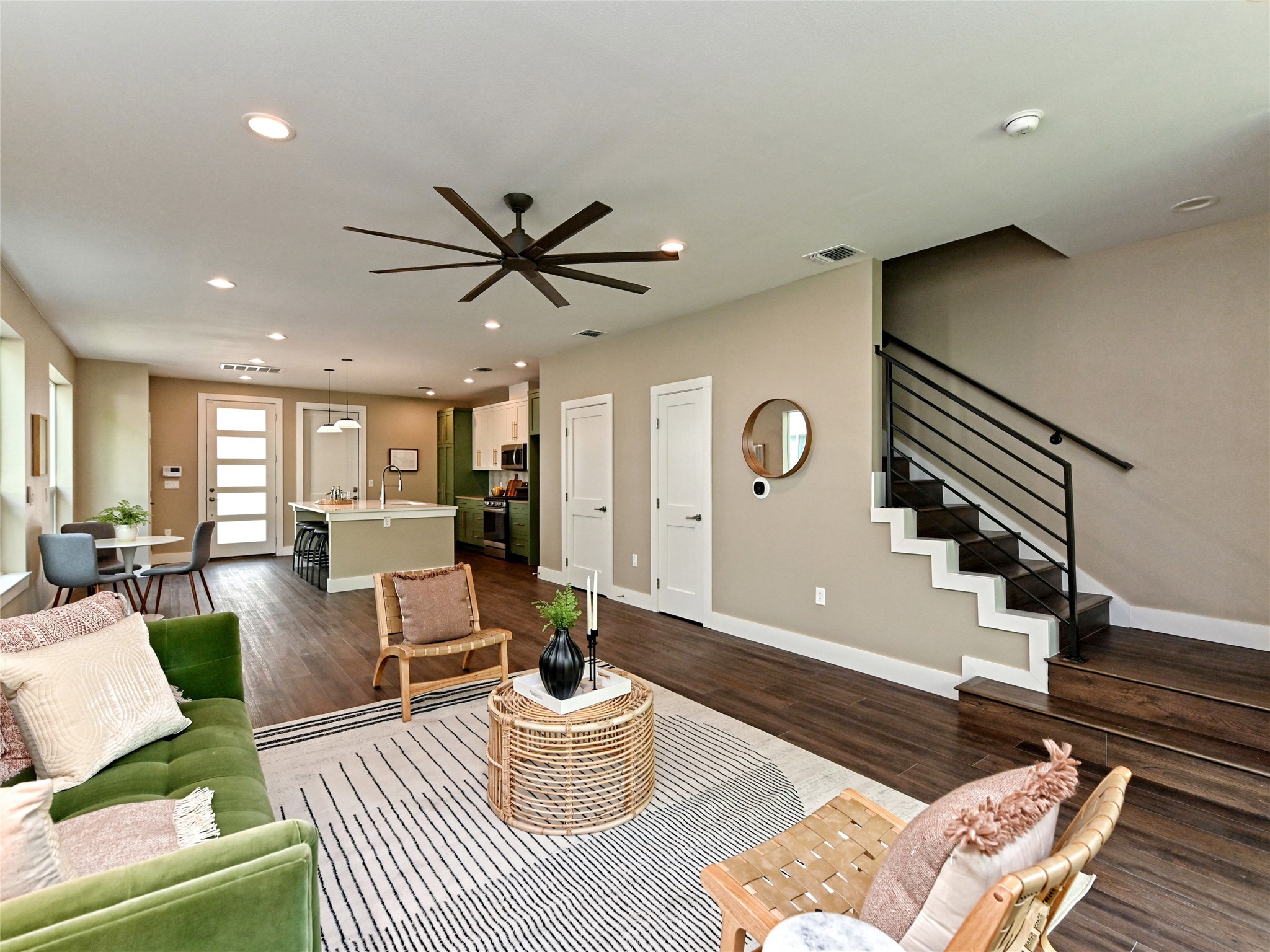 1202 Cometa Street, Unit B Austin, TX 78721 - Photo 6 of 25 a living room with furniture a rug and a chandelier