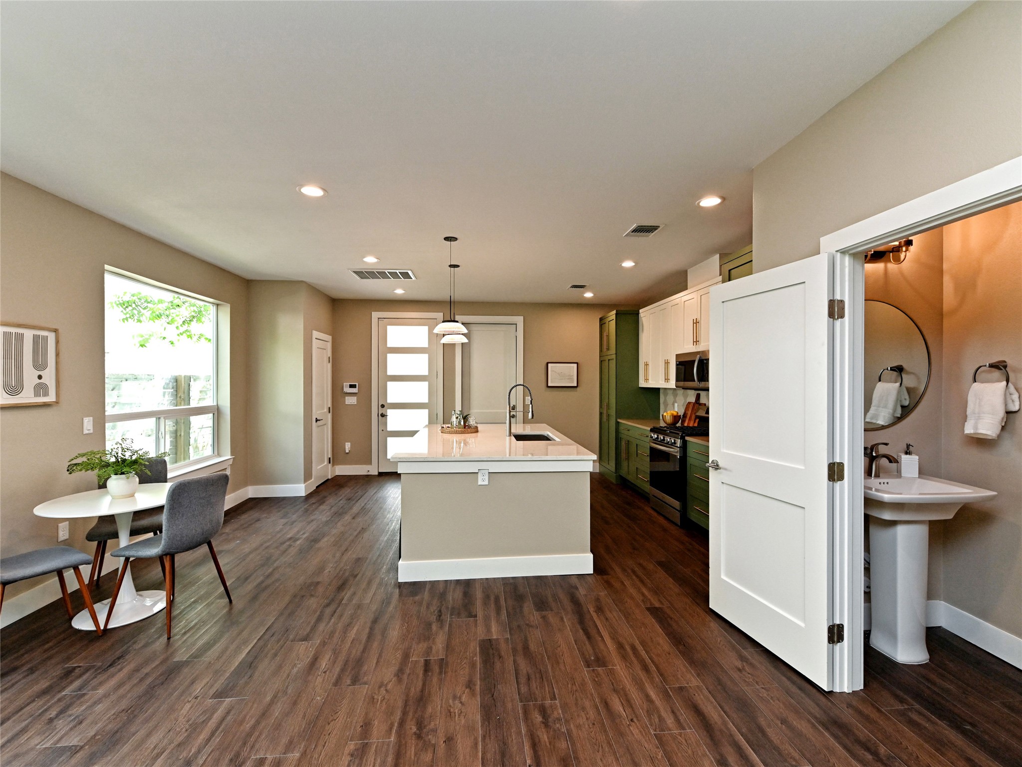 1202 Cometa Street, Unit B Austin, TX 78721 - Photo 8 of 25 a kitchen with a refrigerator a sink and dishwasher with wooden floor