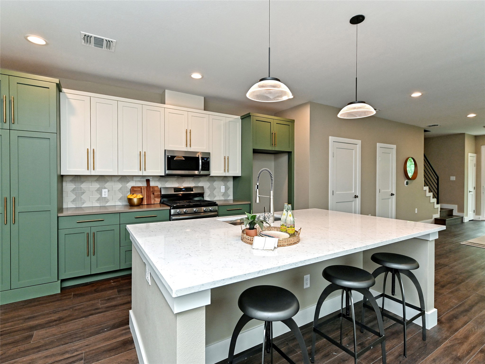 1202 Cometa Street, Unit B Austin, TX 78721 - Photo 10 of 25 a kitchen with a dining table and chairs