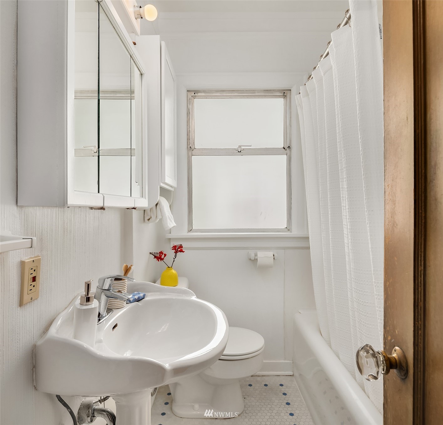 552 North 68th Street Seattle, WA 98103 - Photo 12 of 17 a bathroom with a sink toilet and vanity