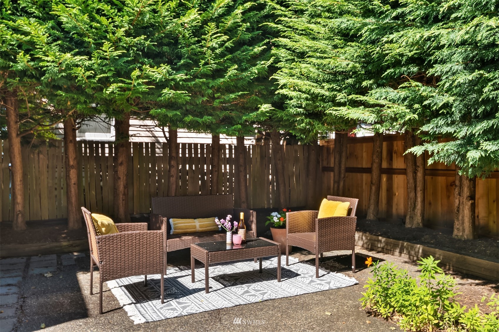 552 North 68th Street Seattle, WA 98103 - Photo 17 of 17 a view of backyard with outdoor seating and trees