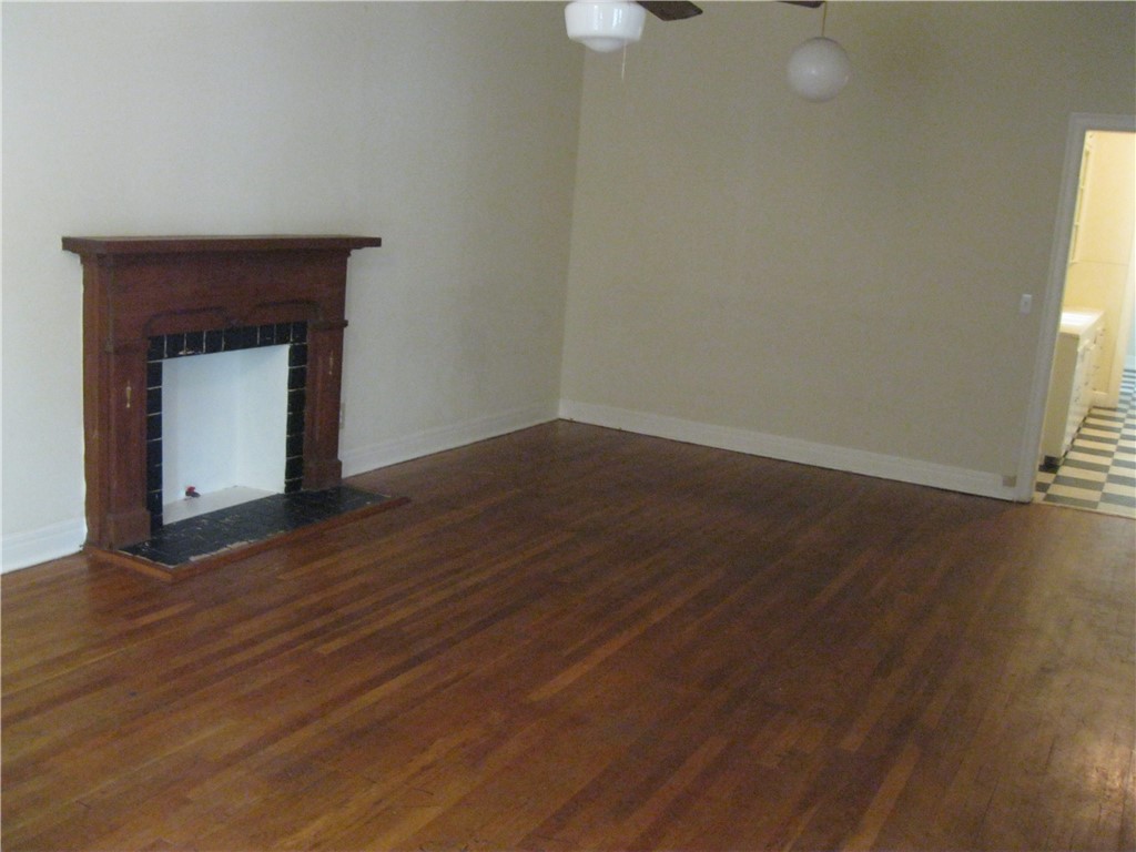 2800 Whitis Avenue, Unit D Austin, TX 78705 - Photo 3 of 3 a view of an empty room with wooden floor and a window