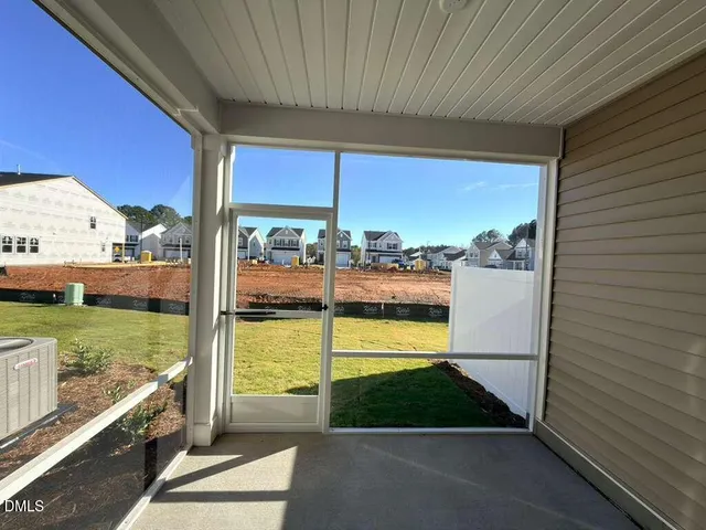 a view of two chairs in the balcony