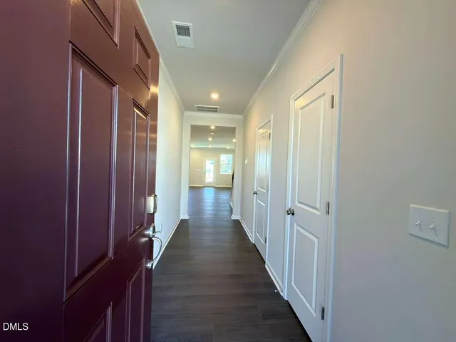 a hallway with wooden floor