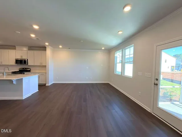 a view of kitchen with window and wooden floor