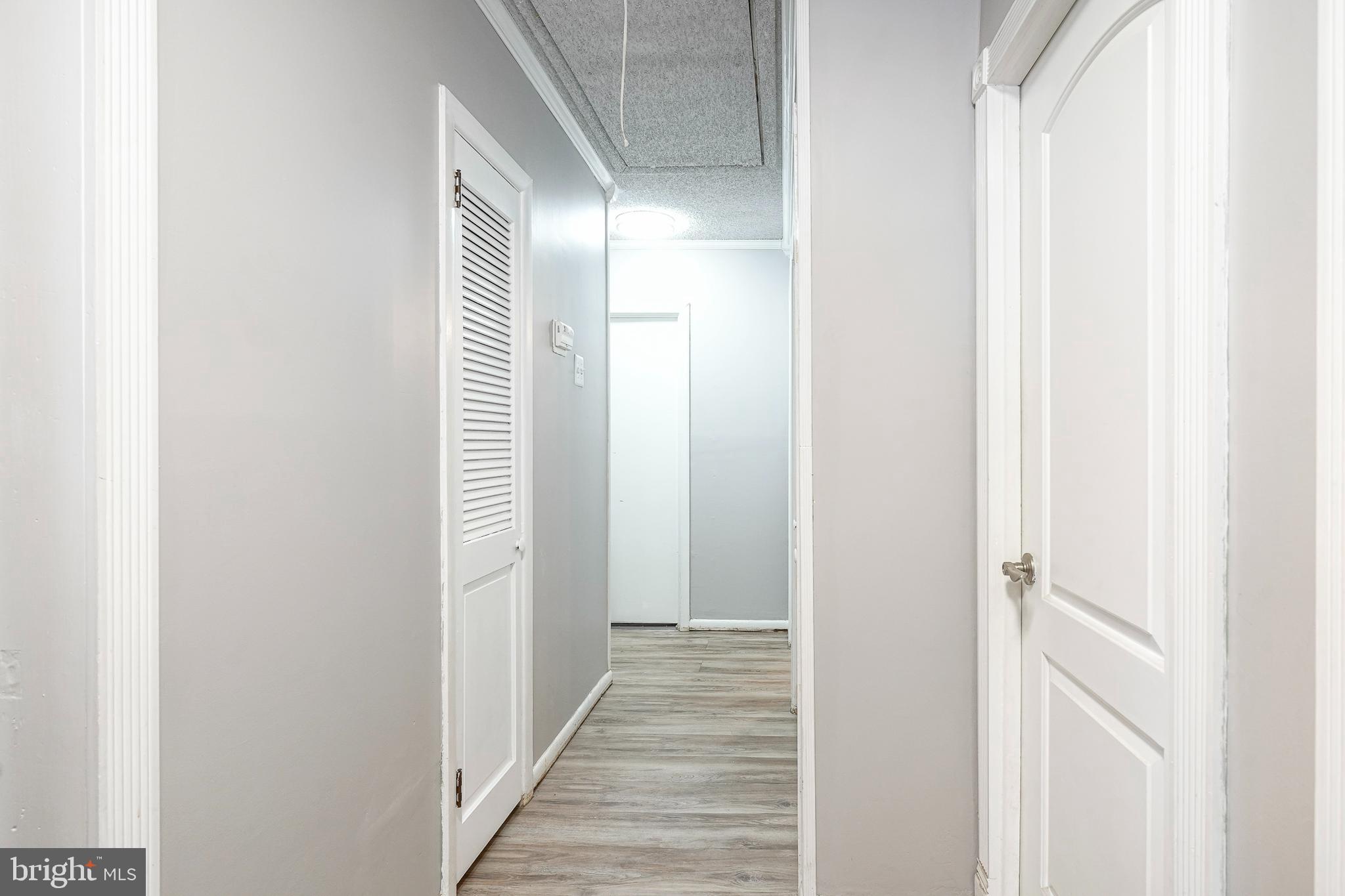 8 Rose Avenue Maple Shade, NJ 08052 - Photo 11 of 26 a view of a hallway with wooden floor
