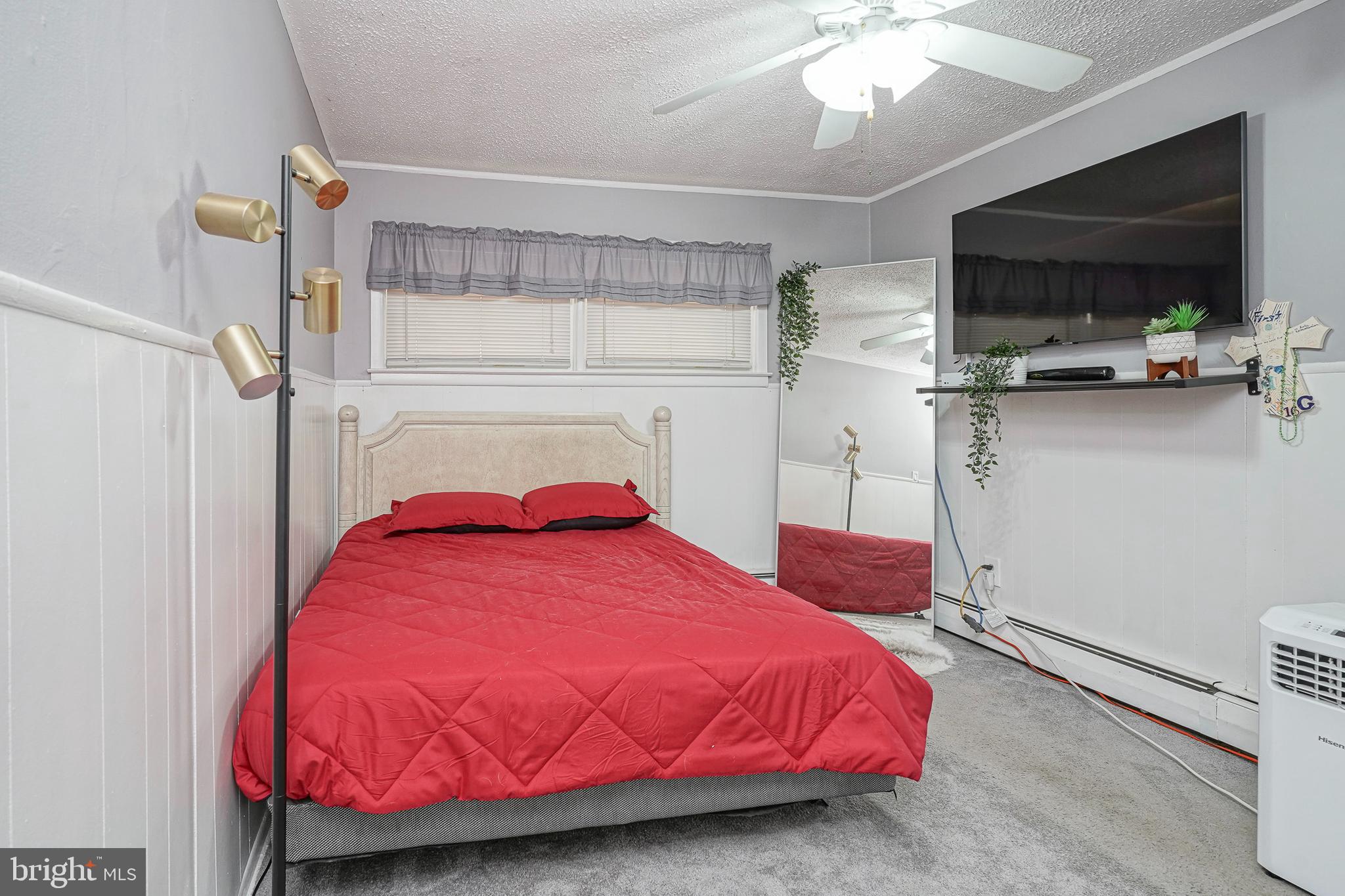 8 Rose Avenue Maple Shade, NJ 08052 - Photo 12 of 26 a bedroom with a bed and a flat tv screen on the wall