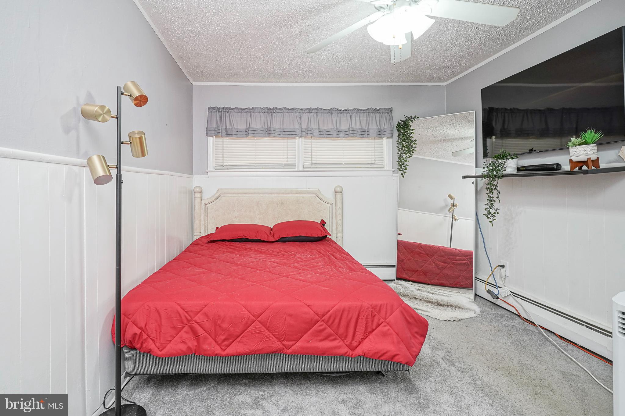 8 Rose Avenue Maple Shade, NJ 08052 - Photo 13 of 26 a bedroom with a bed and a mirror