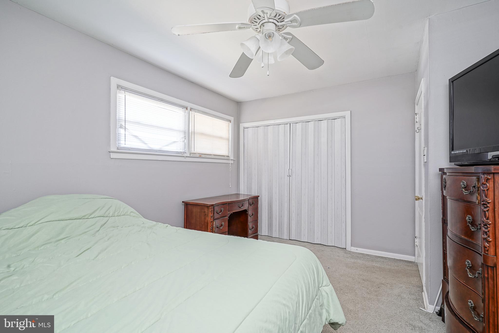 8 Rose Avenue Maple Shade, NJ 08052 - Photo 15 of 26 a bedroom with a bed and a flat tv screen on dresser