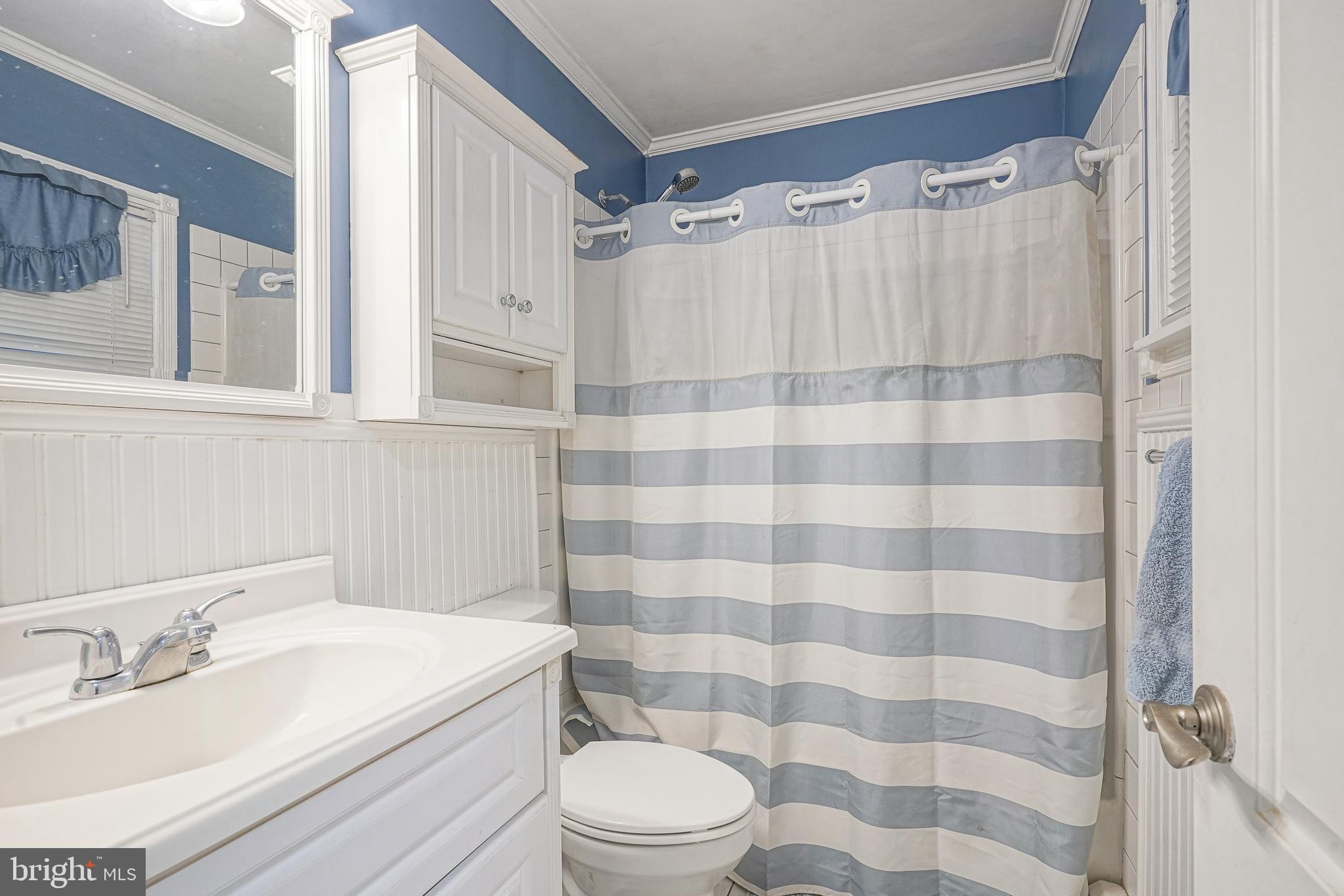 8 Rose Avenue Maple Shade, NJ 08052 - Photo 16 of 26 a bathroom with a sink a toilet a shower and a mirror