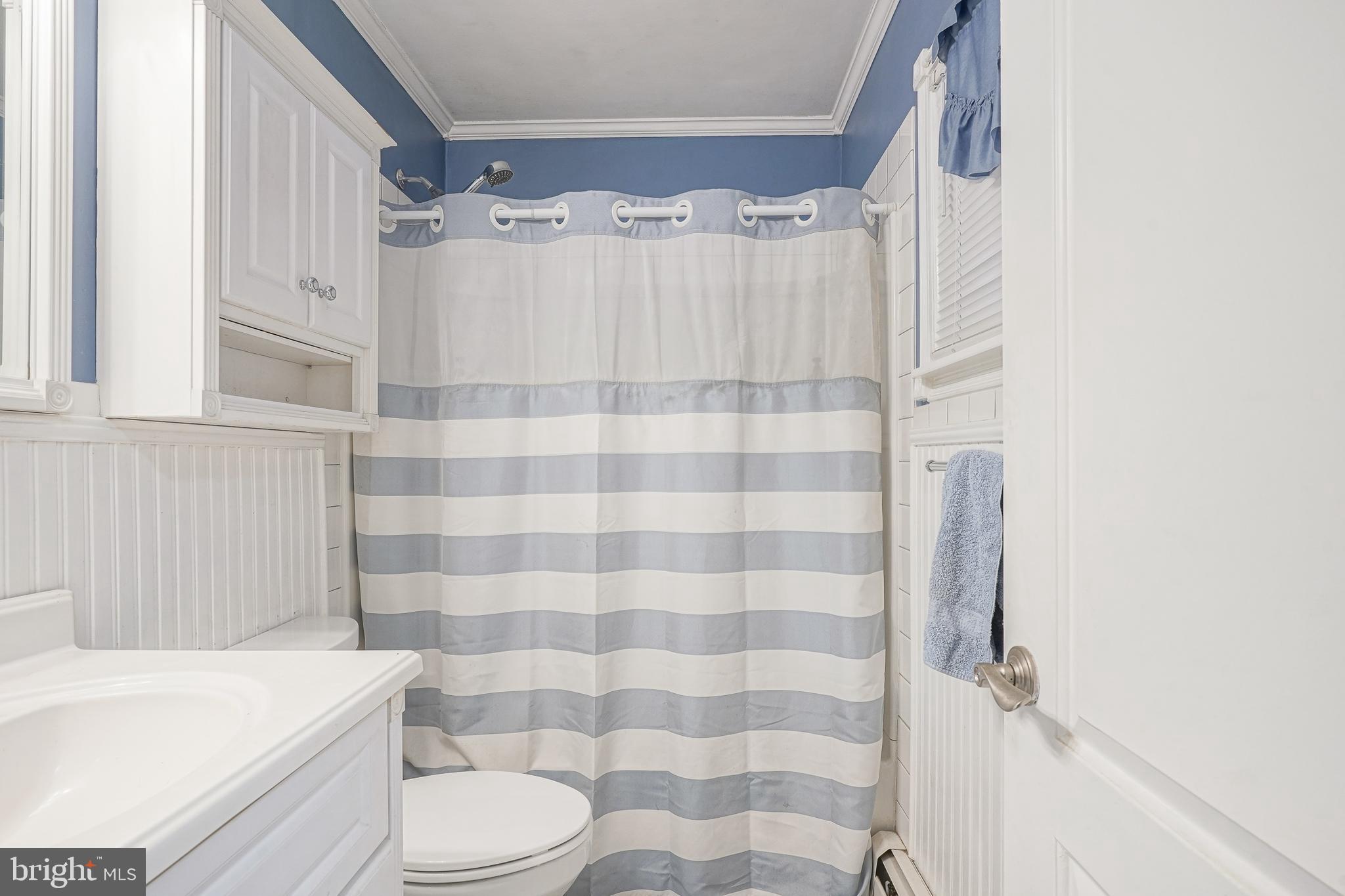 8 Rose Avenue Maple Shade, NJ 08052 - Photo 17 of 26 a bathroom with a shower curtain