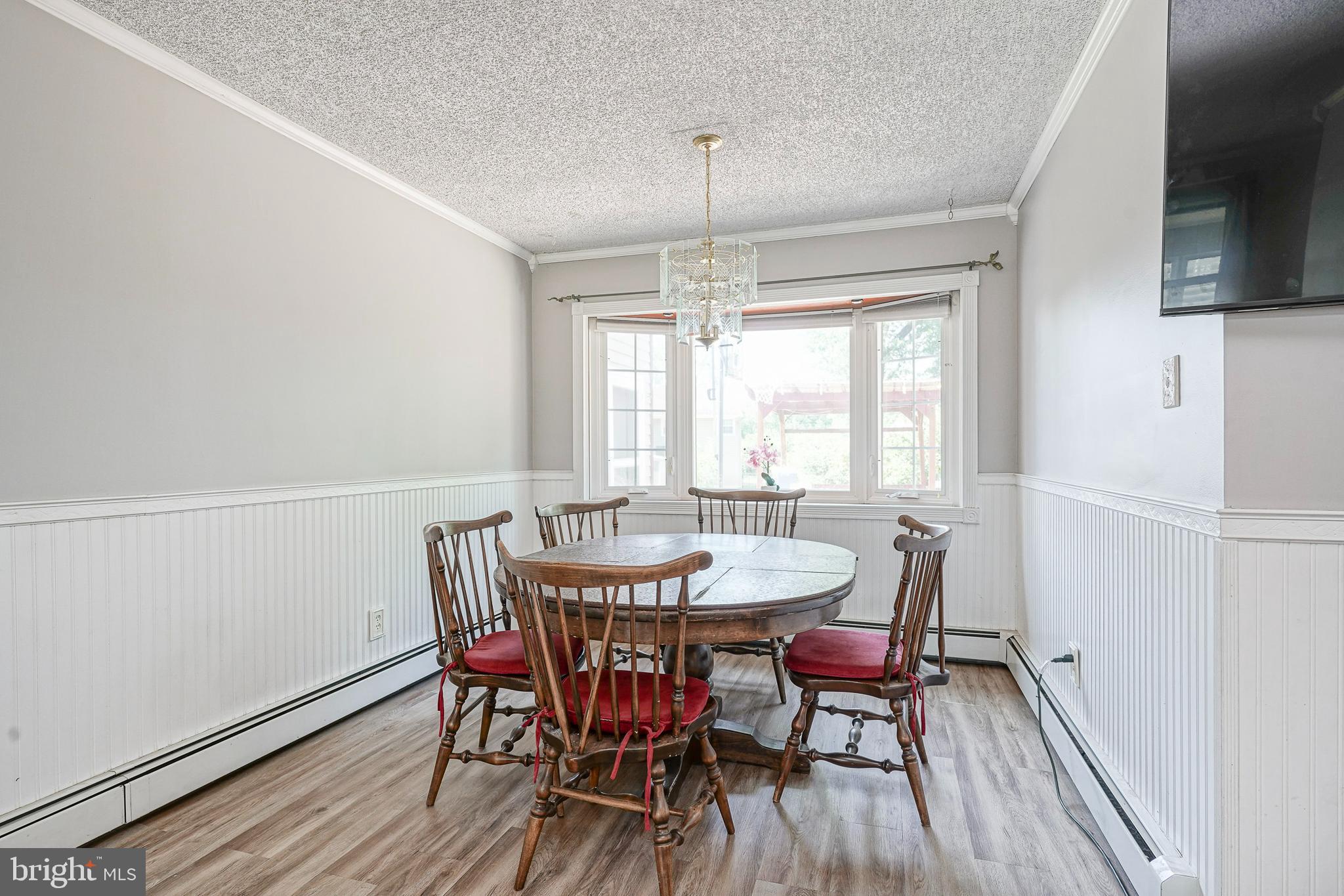 8 Rose Avenue Maple Shade, NJ 08052 - Photo 6 of 26 a dining room with furniture a chandelier and wooden floor