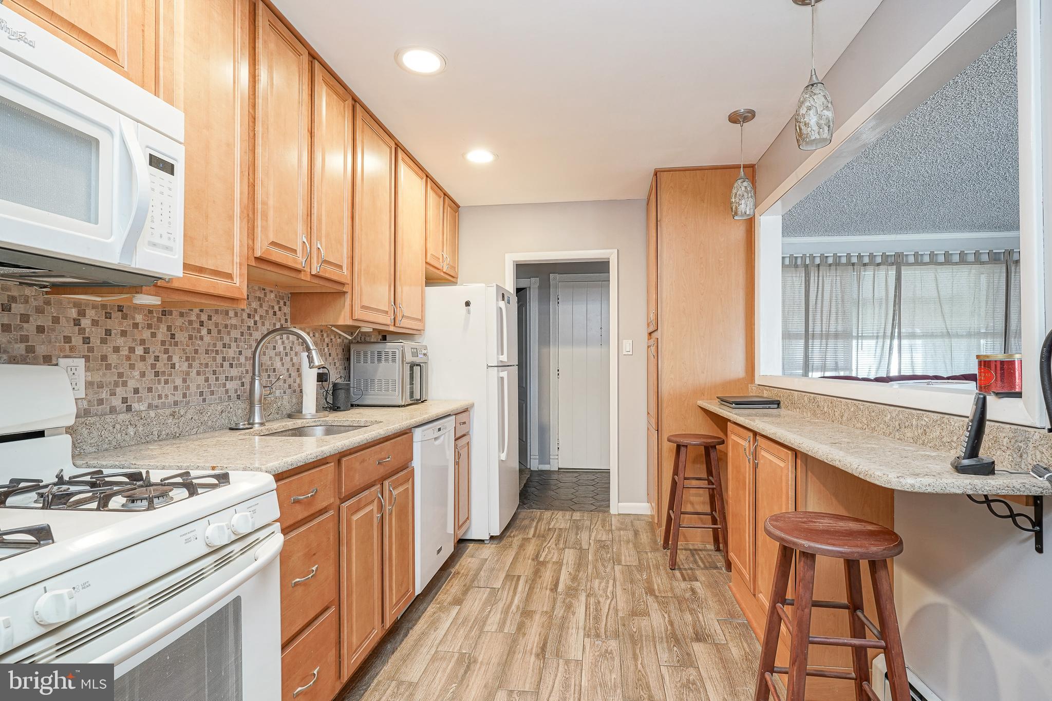 8 Rose Avenue Maple Shade, NJ 08052 - Photo 8 of 26 a kitchen with stainless steel appliances granite countertop a sink stove and refrigerator