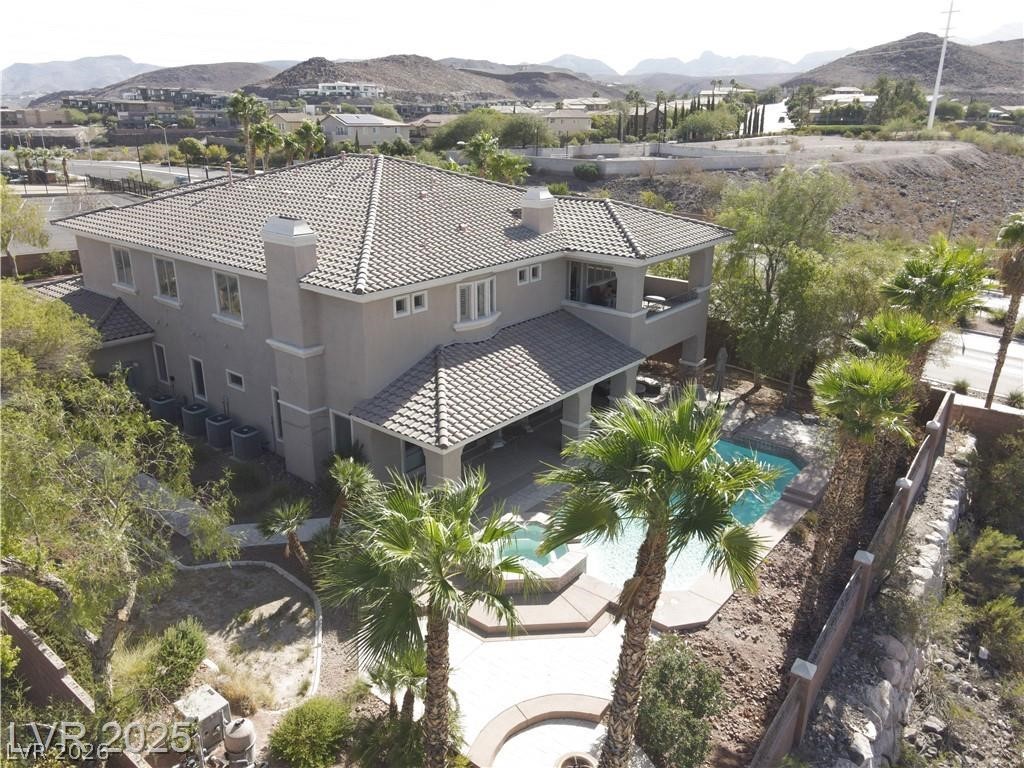 861 Majestic Ridge Court Henderson, NV 89052 - Photo 1 of 68 Drone / aerial view of a mountainous background and a pool