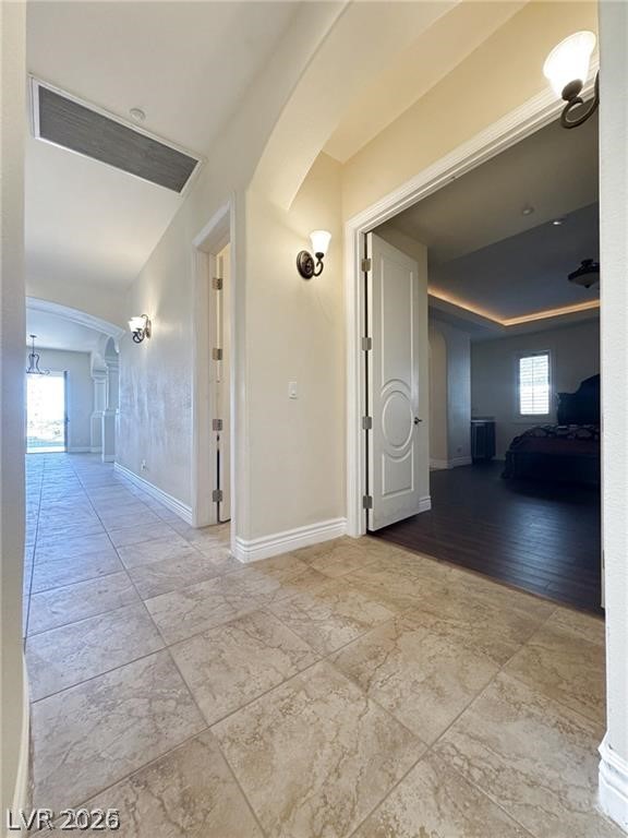 861 Majestic Ridge Court Henderson, NV 89052 - Photo 16 of 68 Hall with arched walkways and healthy amount of natural light