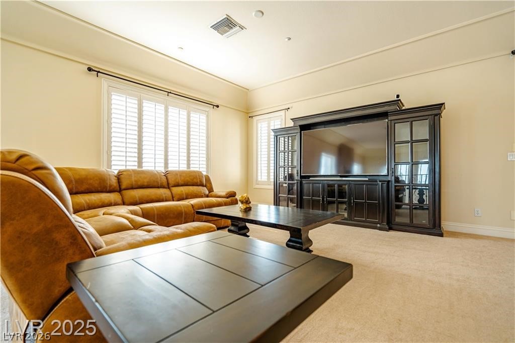 861 Majestic Ridge Court Henderson, NV 89052 - Photo 32 of 68 Living area with carpet and baseboards