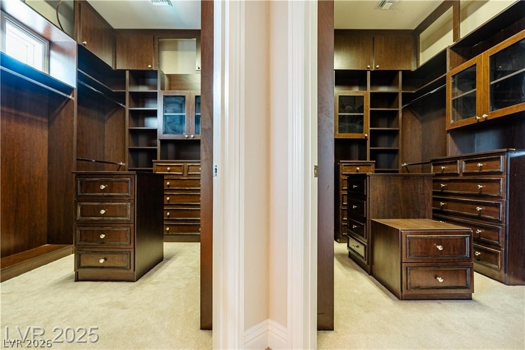 861 Majestic Ridge Court Henderson, NV 89052 - Photo 43 of 68 Walk in closet featuring light carpet