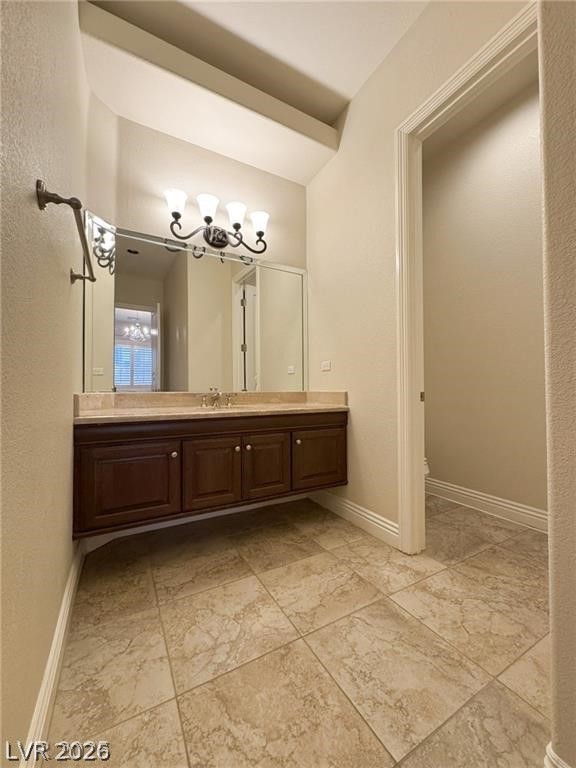 861 Majestic Ridge Court Henderson, NV 89052 - Photo 47 of 68 Bathroom with vanity and a textured wall